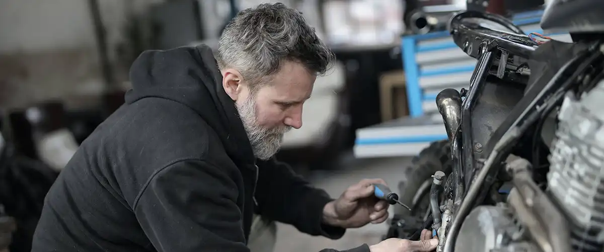 Man working on a car engine