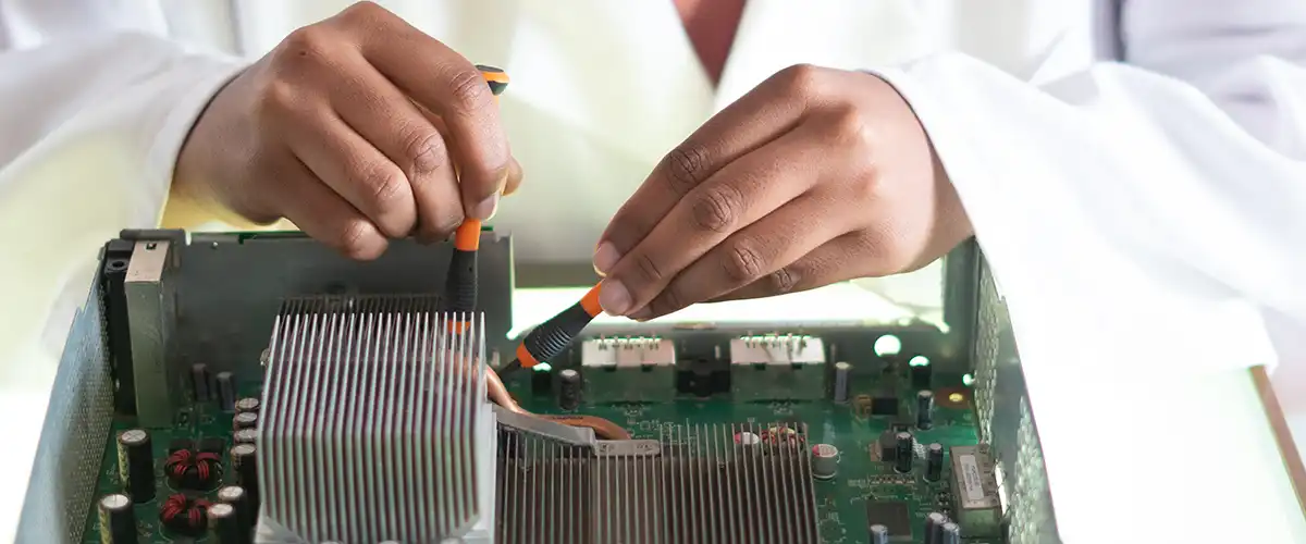 Woman working on a motherboard component