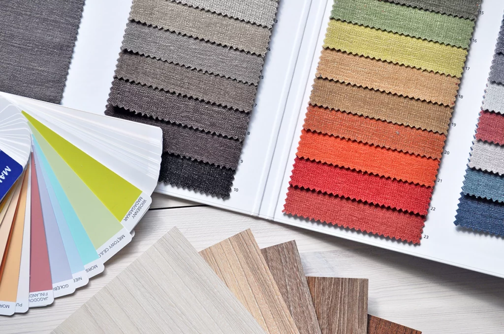 A table holds several color swatches for fabric, paint, and flooring.