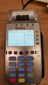 Verifone terminal on table displaying two options; full or partial