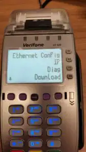 Verifone on table displaying 4 options on screen